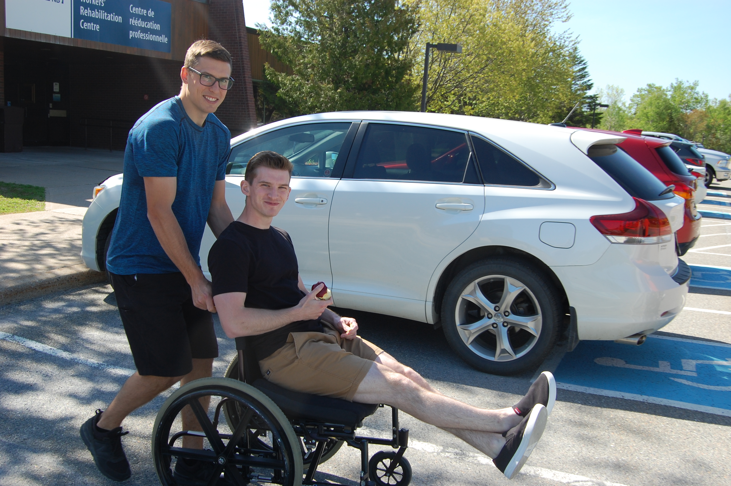 WorkSafeNB occupational therapist Andy West helps summer student Brandon Sloot navigate his wheelchair around WorkSafeNB’s Rehabilitation Centre in Grand Bay-Westfield.
